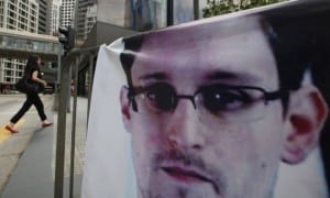 a-banner-supporting-edward-snowden-is-displayed-in-hong-kongs-business-district-june-20