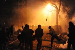 Image Credit: Wikipedia Protesters throwing pieces of paving during and metal tubes at riot police during clashes at Bankova str, Kiev, Ukraine. 