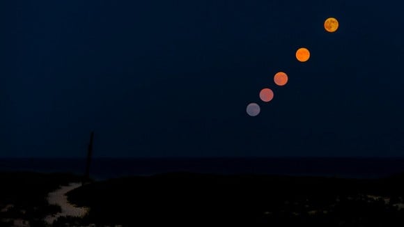 Supermoon timelapse composite on August 10 near the ship mast at Barnegat Light on Long Beach Island, New Jersey. Credit and copyright: FrankM301 on Flickr.