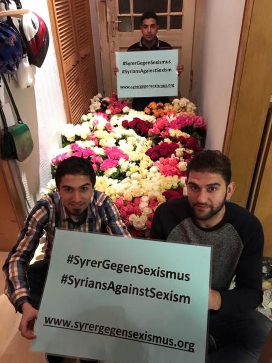 Two refugees with flowers to be handed out to ladies on German streets. Credit: Syrians Against Sexism 