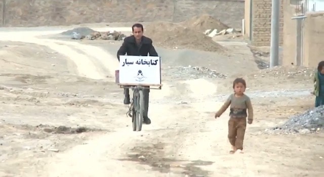 Teacher Turns Bike Into A Mobile Library To Fight Illiteracy In Afghanistan [Watch]