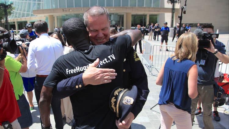 Black Man’s ‘Free Hugs Project’ Focuses On Police, Sheds Light On Their Humanity [Must Watch]