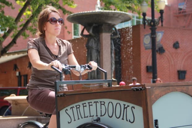 Every Week, This Literature Professor Bikes Books To 5,000 Homeless People [Watch]