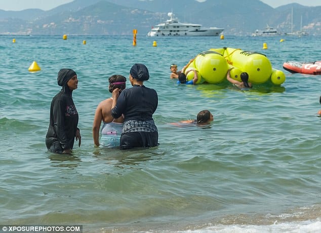 Four Muslim women received fines for swimming while wearing burkinis. Credit: XPosurePhotos.com